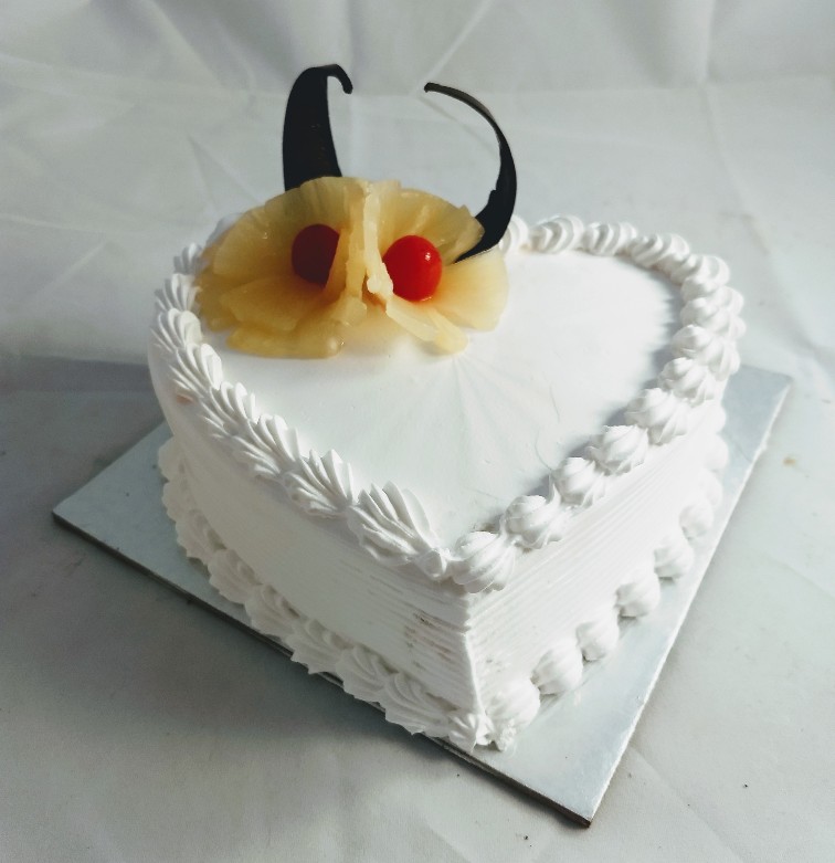 1Kg Heart Shape Pineapple Cake cake delivery V.V.nagar