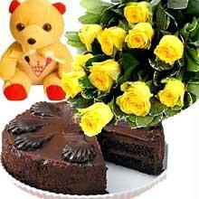 A bunch of 12 Roses with 1/2 kg Chocolate Cake and a cute Teddy cake delivery Delhi